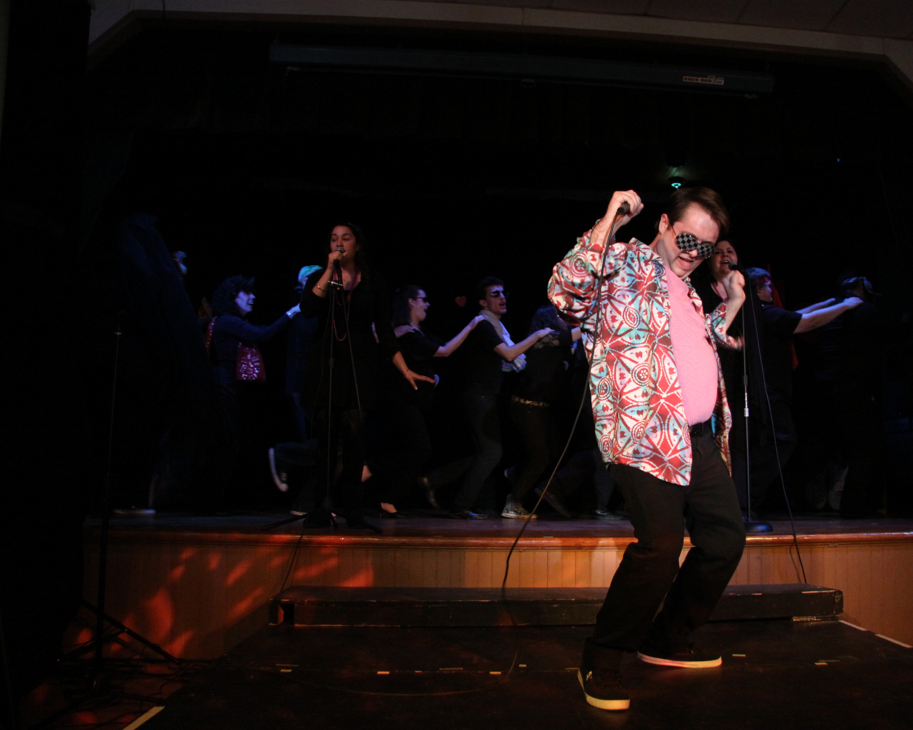 Actors performing with projected visuals